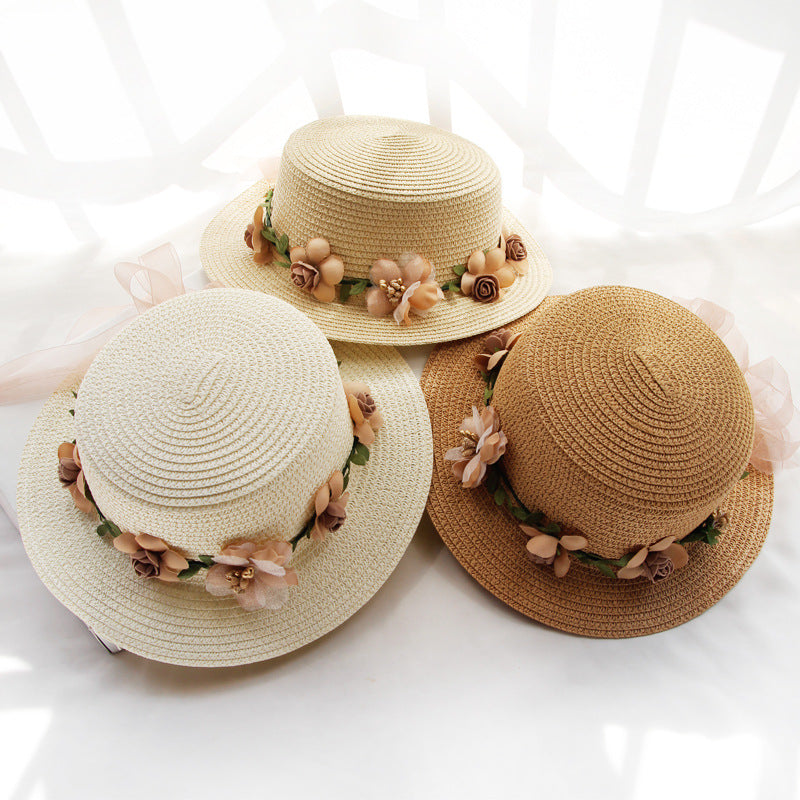 Three Flower Designed Beach Hats by Beachy Cover Ups with flowers on them.