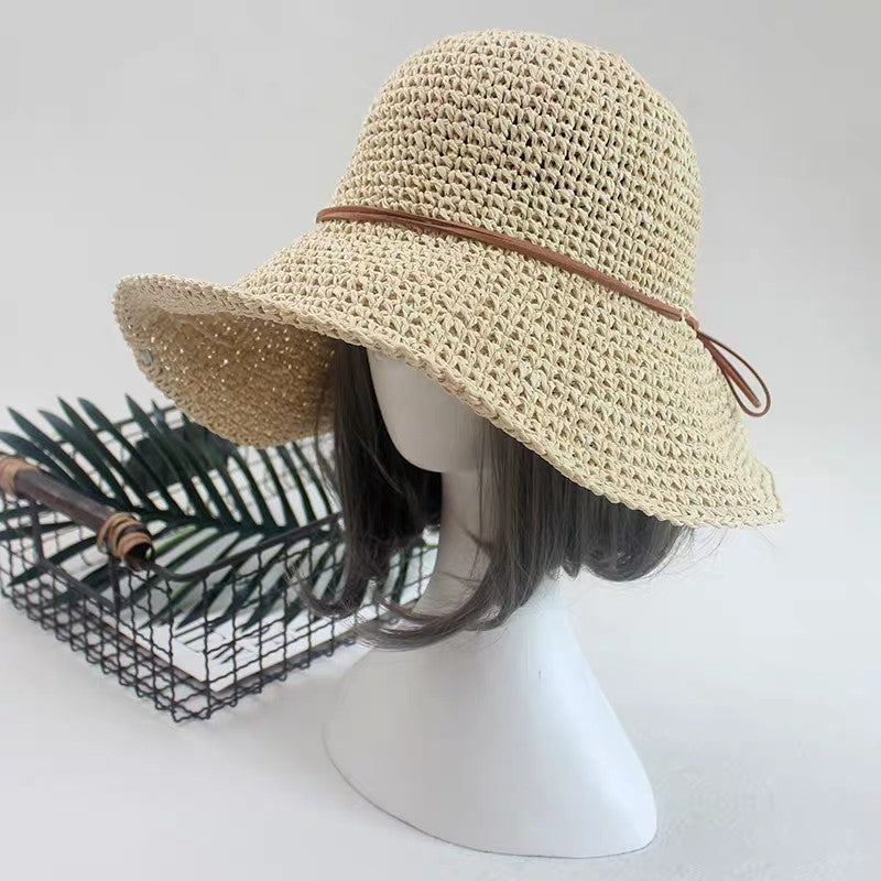 A mannequin donning a Beachy Cover Ups Elegant Foldable Travel Beach Straw Hat.