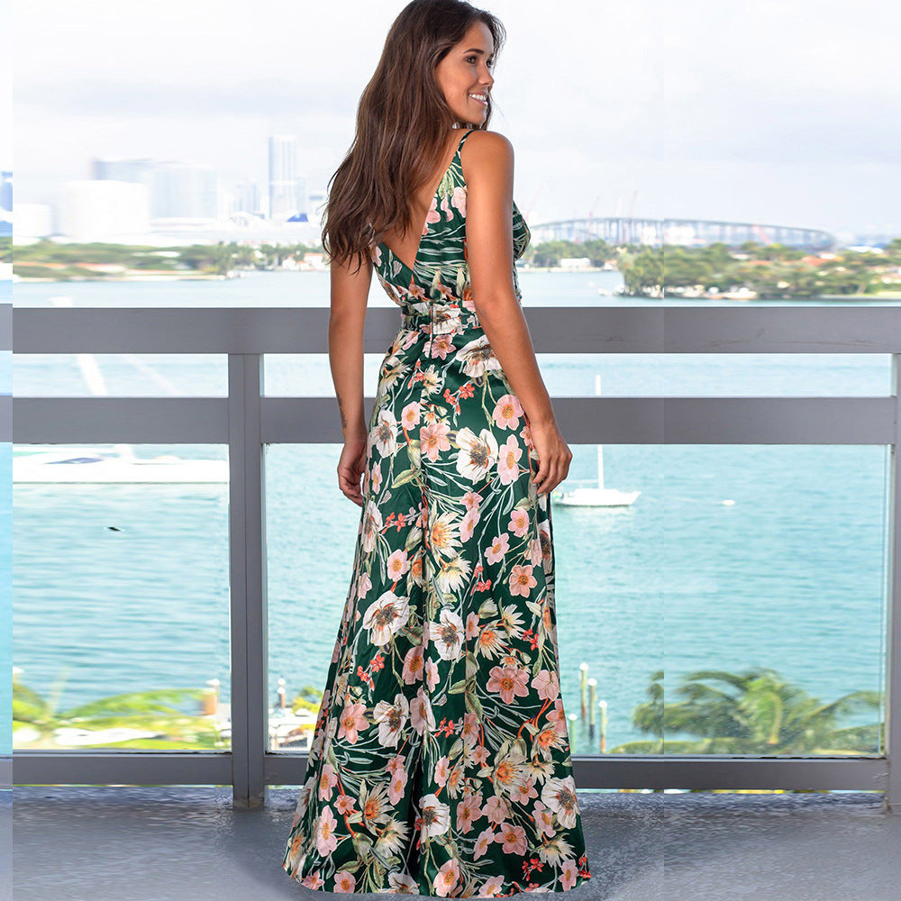 A woman in a Beachy Cover Ups Long Floral Resort Beach Dress standing on a balcony overlooking the water.