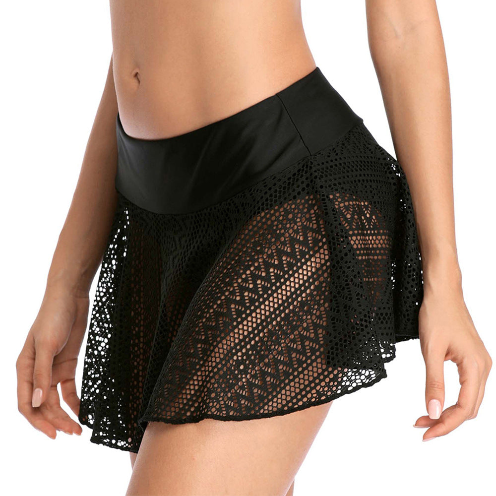 A woman wearing Beachy Cover Ups high-waisted black lace skirt.-
