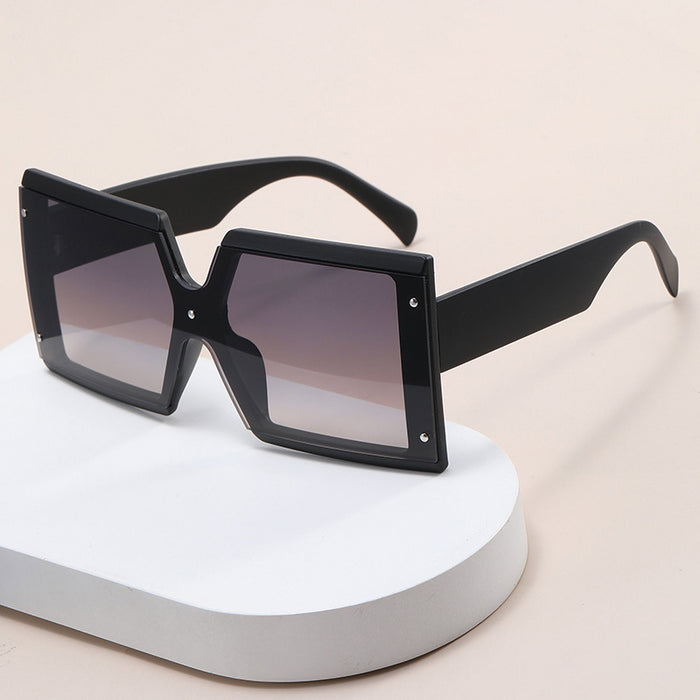 Beachy Cover Ups' Retro Square Sunglasses are a fashionable accessory.