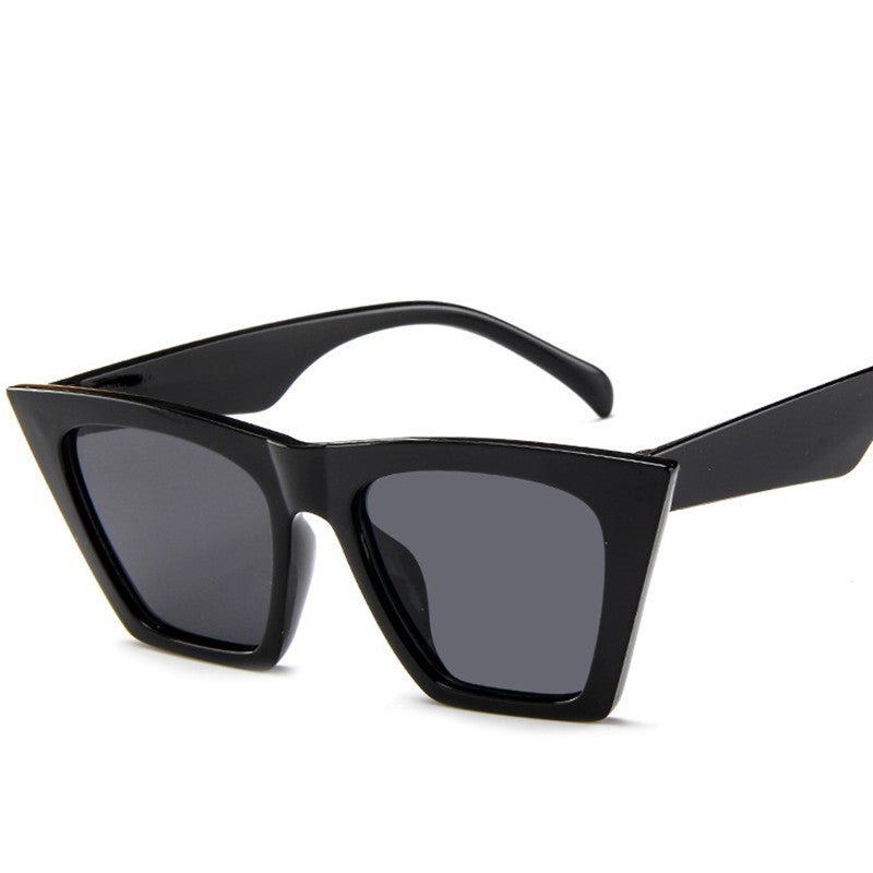 A pair of Beachy Cover Ups Trapezoid Retro Sunglasses on a white background.