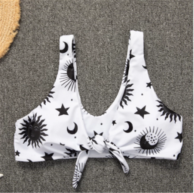 A Beachy Cover Ups Astro Stars Sun And Moon Beach Bikini top with stars and moons motifs.