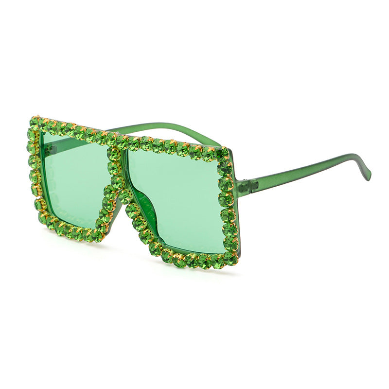 A pair of Diamond-studded Colored Square Sunglasses by Beachy Cover Ups providing UV protection.