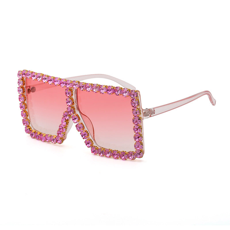 A pair of stylish Diamond-studded Colored Square Sunglasses with UV protection and diamond-studded rhinestones by Beachy Cover Ups.