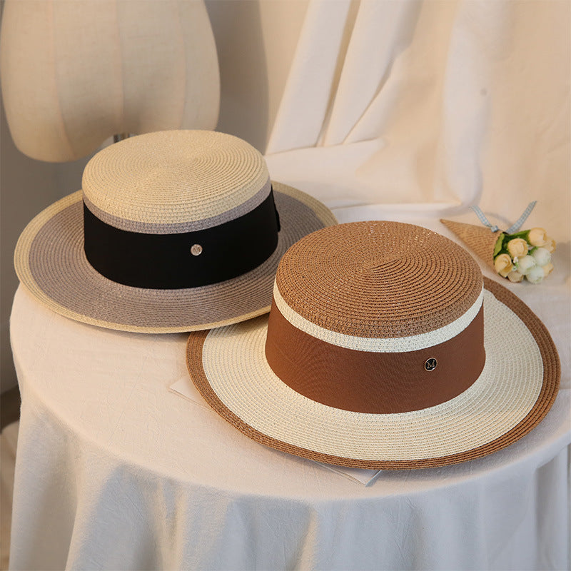 Vintage vibes with two Retro Flat Top Straw Beach Hats by Beachy Cover Ups on a white table.