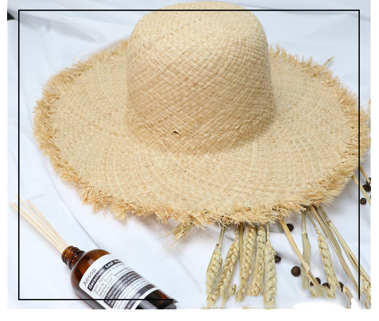 A sun protection ensemble with a Fringed Beach Raffia Ribbon Straw Hat from Beachy Cover Ups.