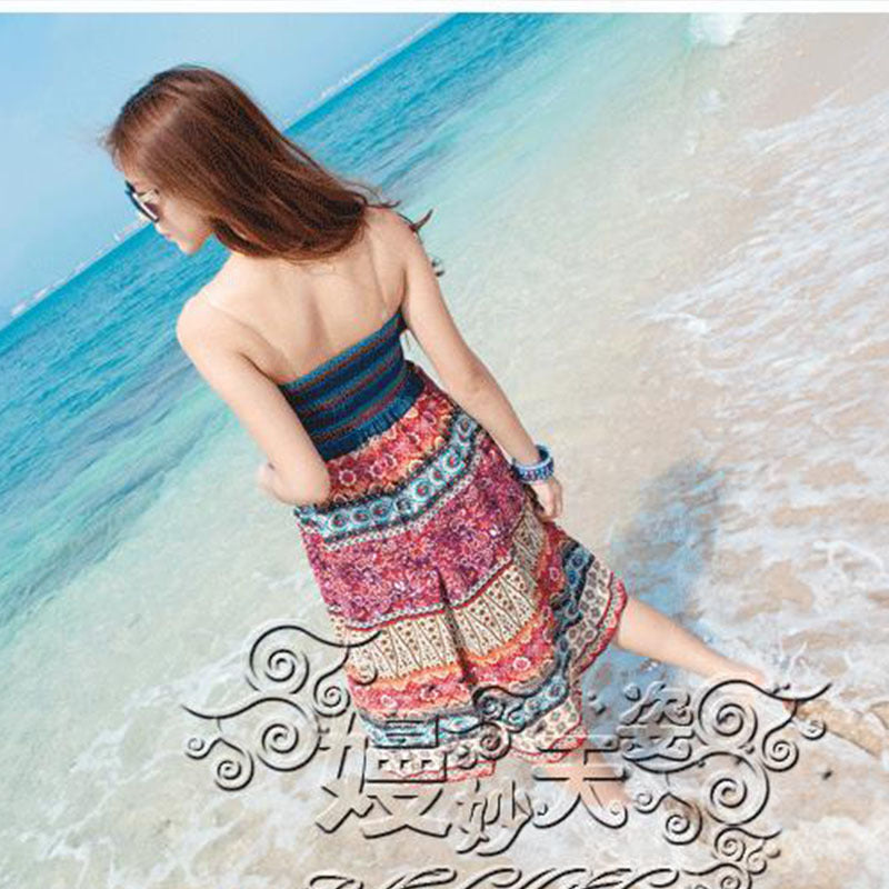 A woman is walking on the beach in a Beachy Cover Ups Strapless Beach holiday Midi boho dress.