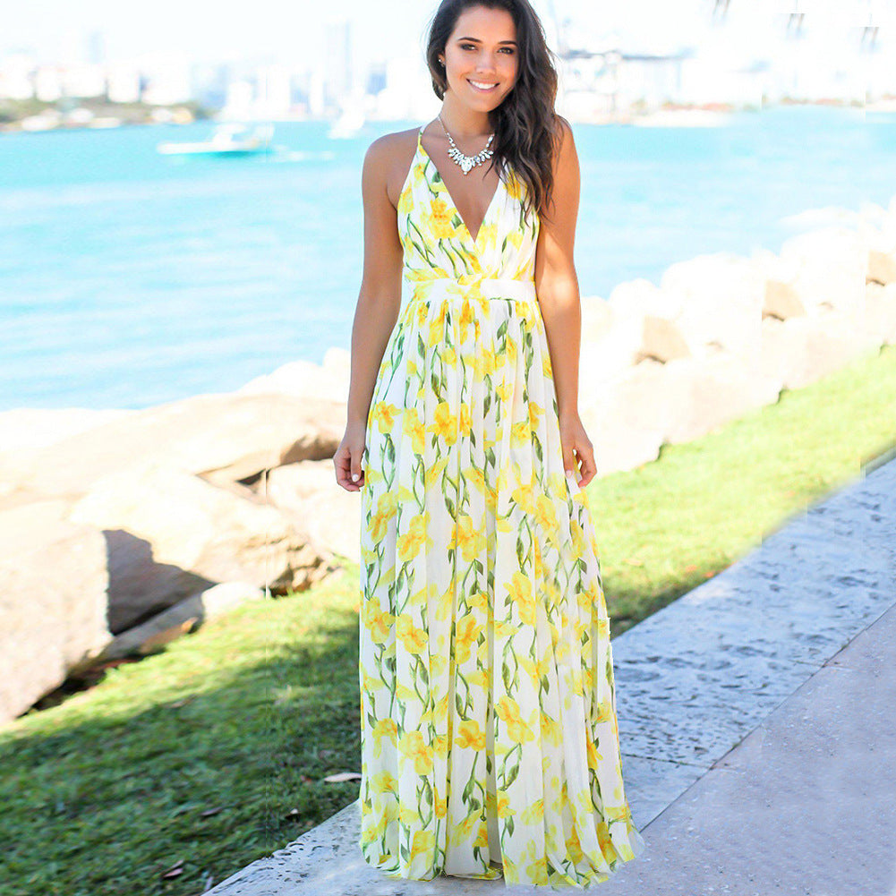 A woman wearing a Beachy Cover Ups Long Floral Resort Beach Dress.