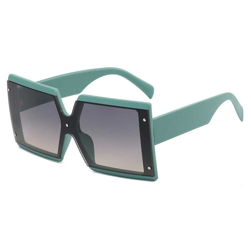 A fashionable vintage charm in Beachy Cover Ups retro square sunglasses with teal frames.