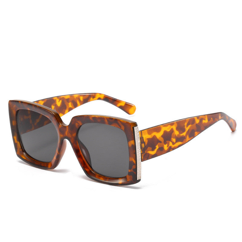 A pair of Beachy Cover Ups trendy large frame sunglasses on a white background.