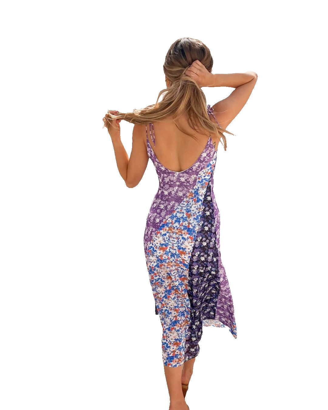 A woman wearing a Purple Floral Mid Summer Dress from Beachy Cover Ups appears comfortable.