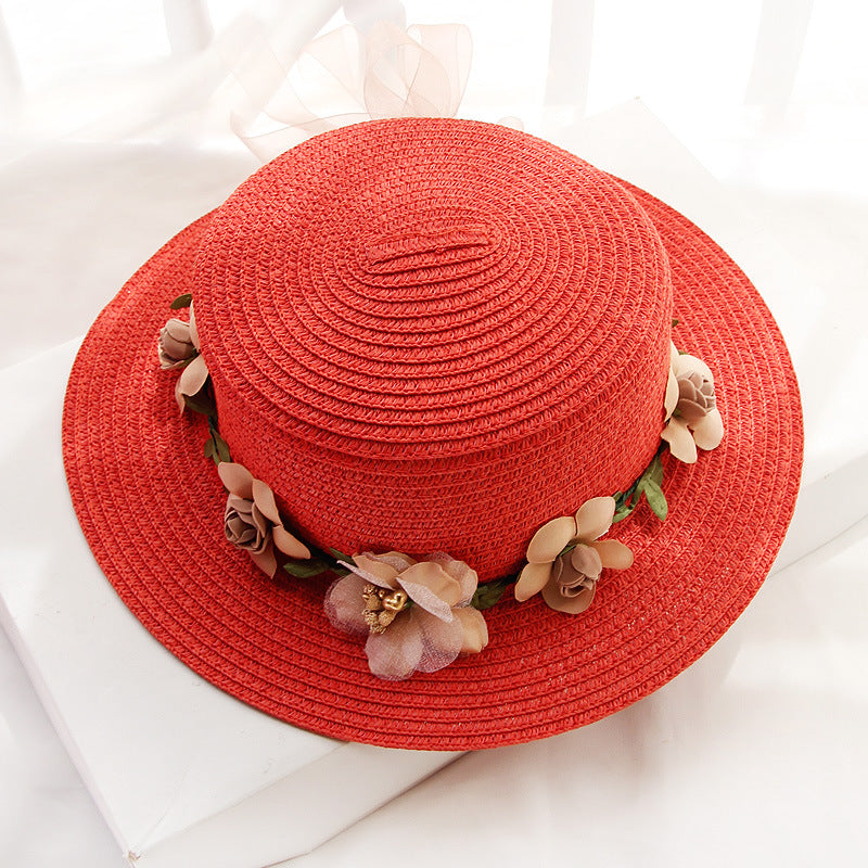 A Flower Designed Beach Hat from Beachy Cover Ups with flowers on it.