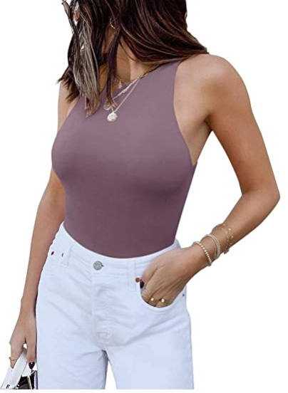 A casual woman wearing a Beachy Cover Ups purple Sleeveless Halter Neck Tank Top and white jeans.
