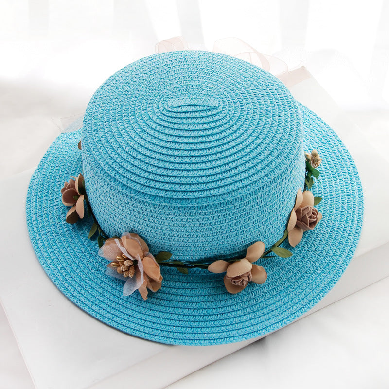 A Flower Designed Beach Hat by Beachy Cover Ups with flowers.