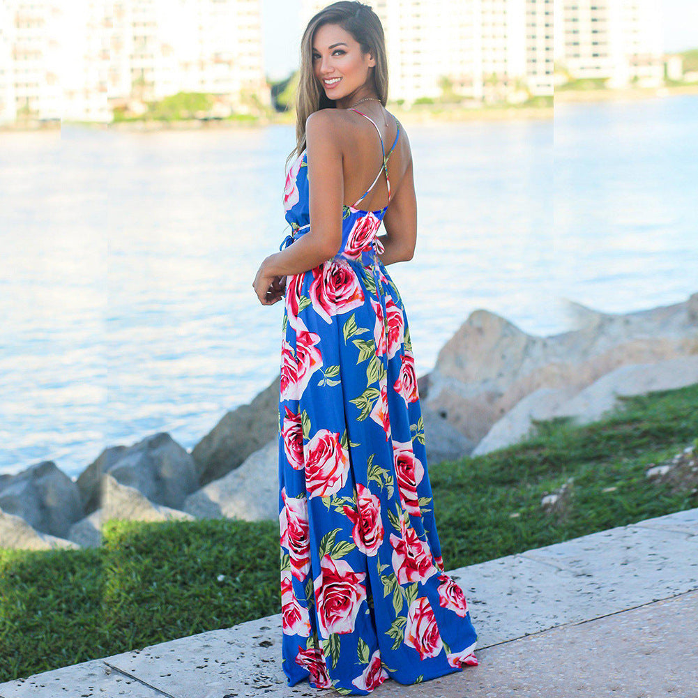 A woman wearing a Long Floral Resort Beach Dress by Beachy Cover Ups.