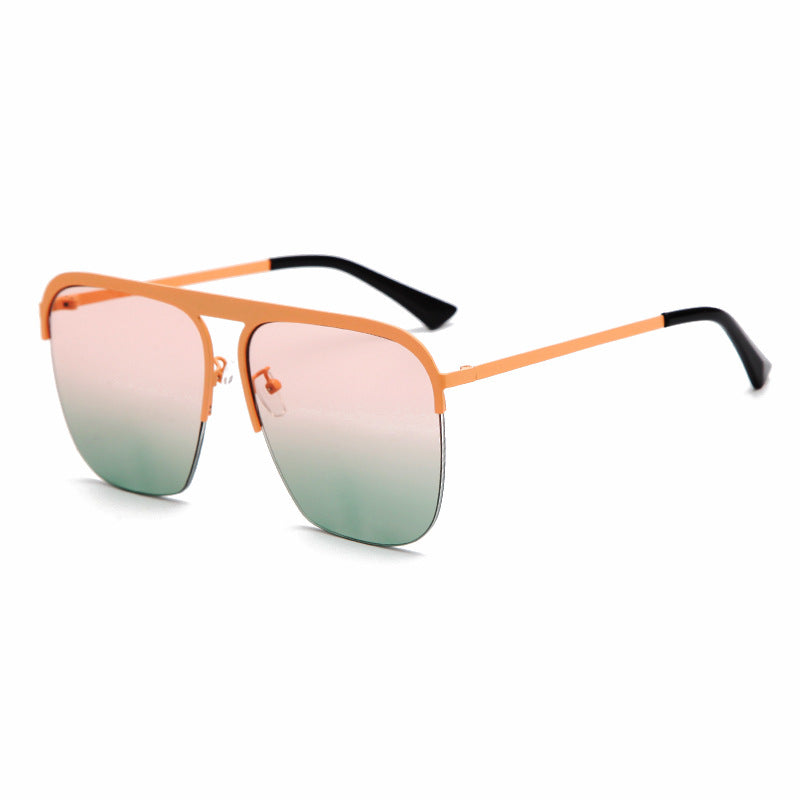 A stylish pair of Large Half Frame Sunglasses by Beachy Cover Ups with a pink and orange frame.