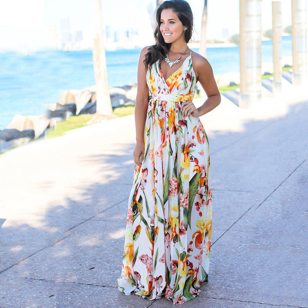 A woman in a Long Floral Resort Beach Dress from Beachy Cover Ups, exuding elegance.