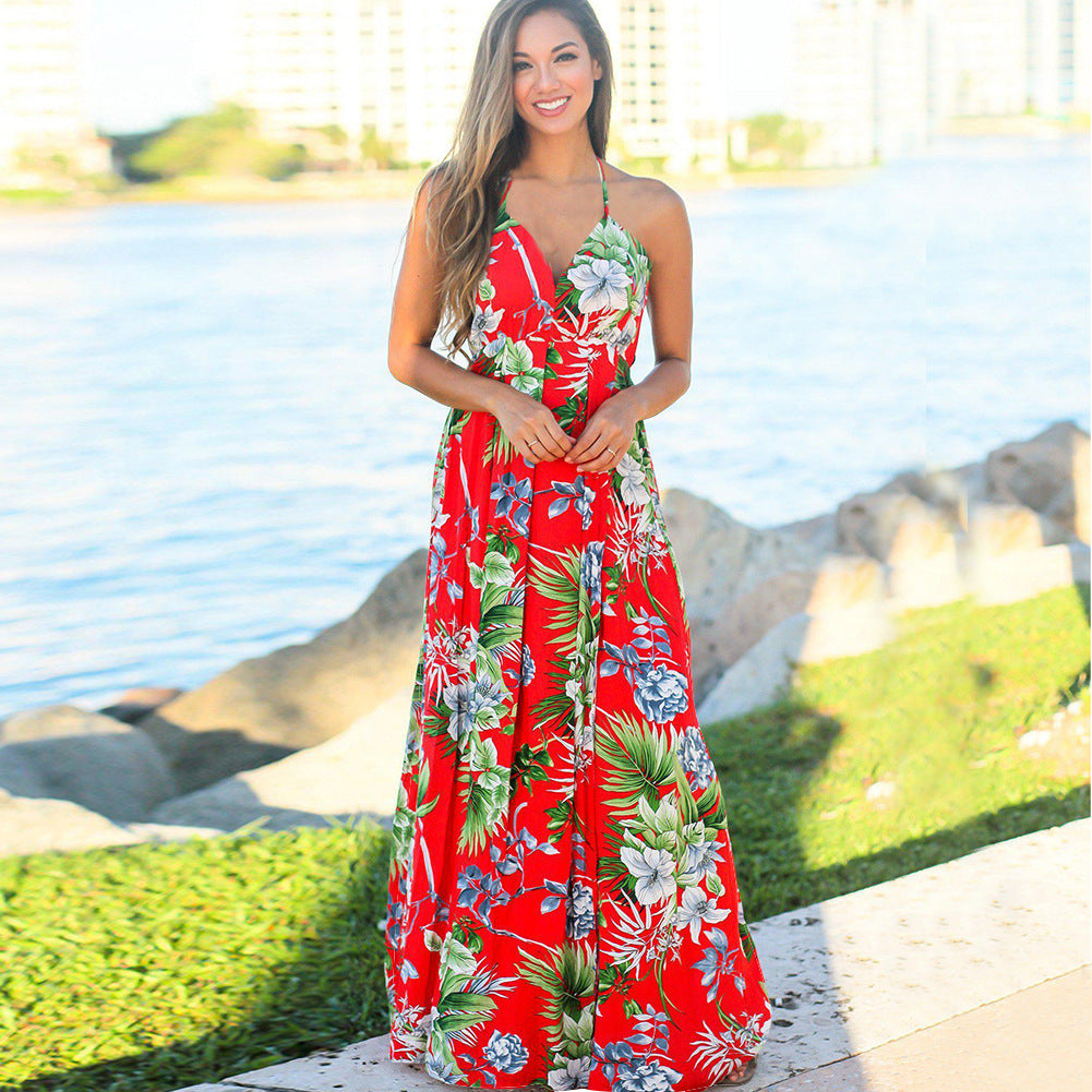 A woman wearing a Long Floral Resort Beach Dress by Beachy Cover Ups.