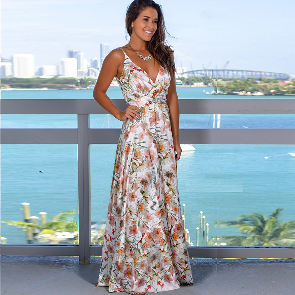 A woman standing on a balcony in a Long Floral Resort Beach Dress by Beachy Cover Ups.