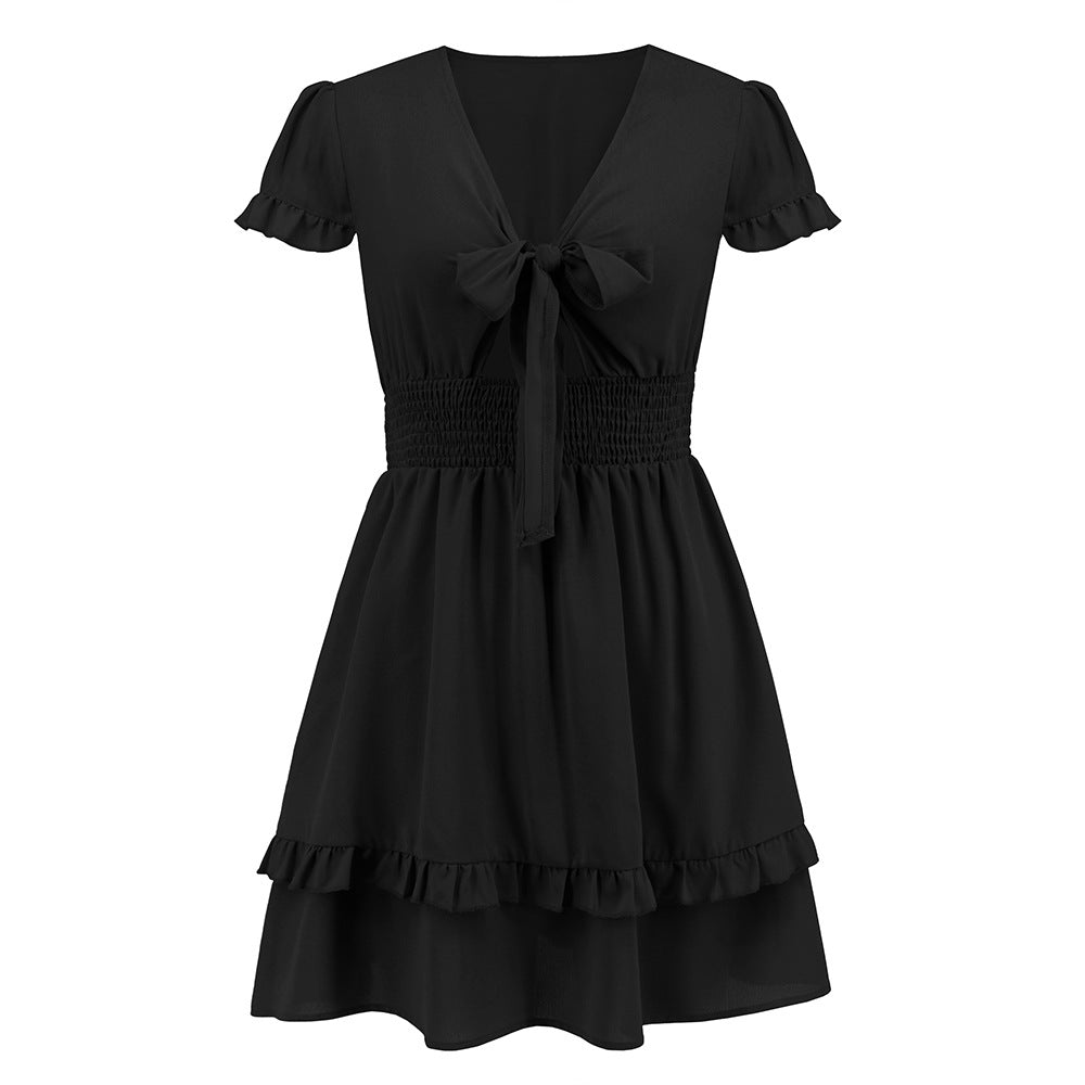 A black Solid Color Ribbon Tie Beach Dress with ruffles and a ribbon tie by Beachy Cover Ups.