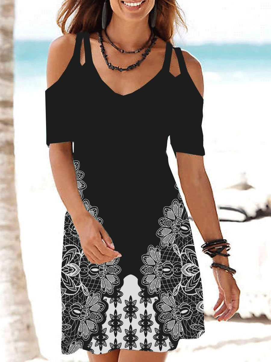 A woman wearing a Beachy Cover Ups Dress Printed Sexy Strap Dress on the beach.