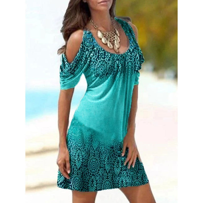 A woman wearing a Beachy Cover Ups Printed Sexy Strap Dress on the beach.