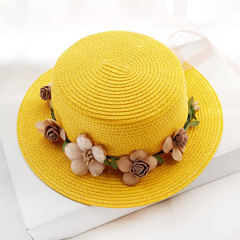 A wide brim Flower Designed Beach Hat adorned with colorful flowers from Beachy Cover Ups.