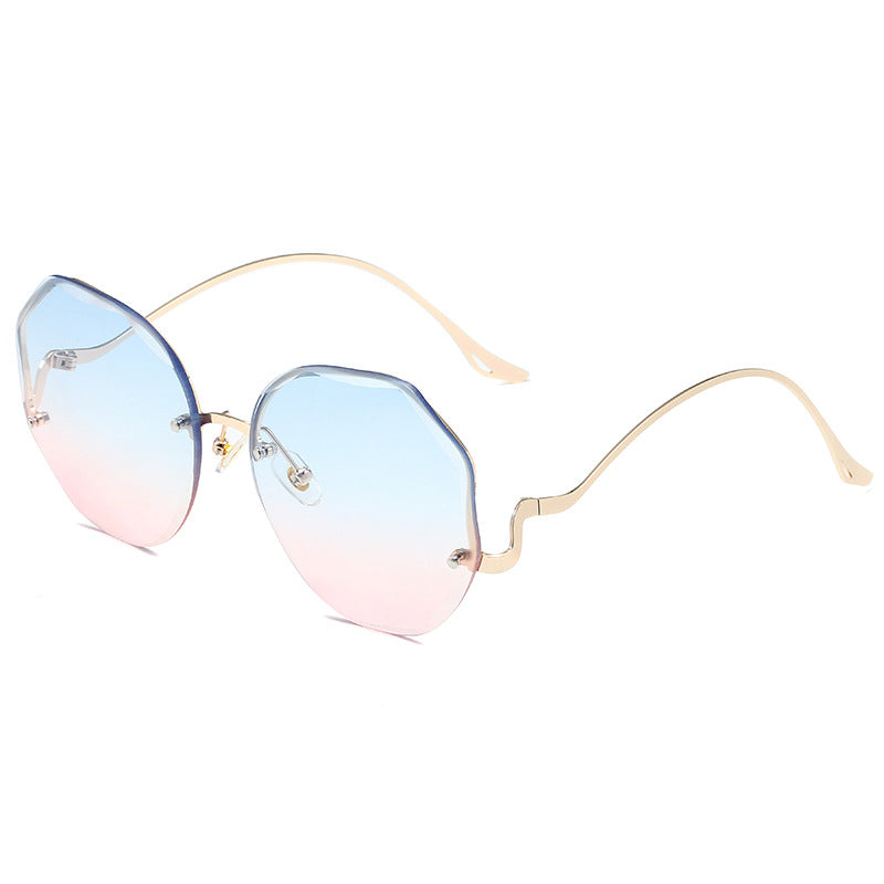 A pair of Irregular Shaped Rimless Cut Edge Sunglasses by Beachy Cover Ups with octagonal shape and colorful rims.