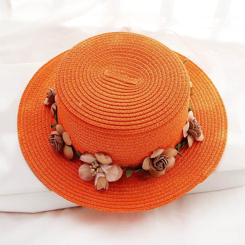 An orange wide brim Flower Designed Beach Hat with flowers on it from Beachy Cover Ups.