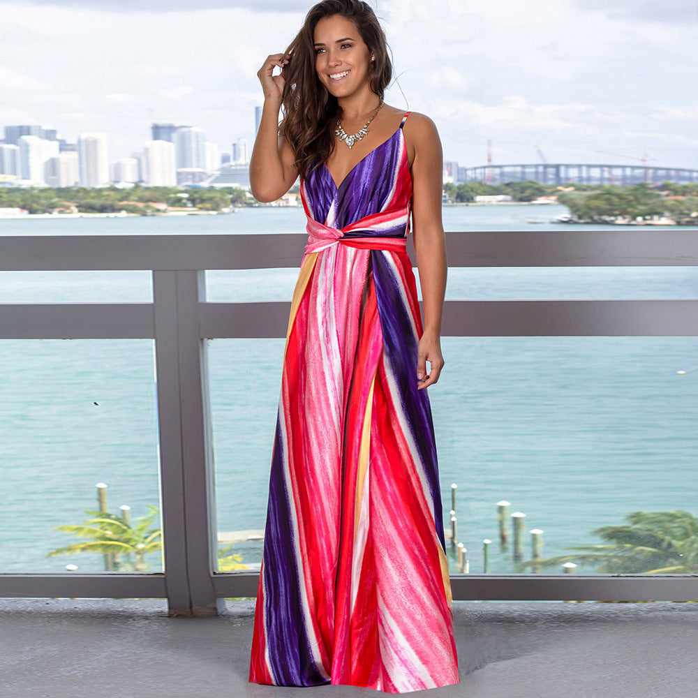 A woman wearing a Beachy Cover Ups Long Floral Resort Beach Dress.