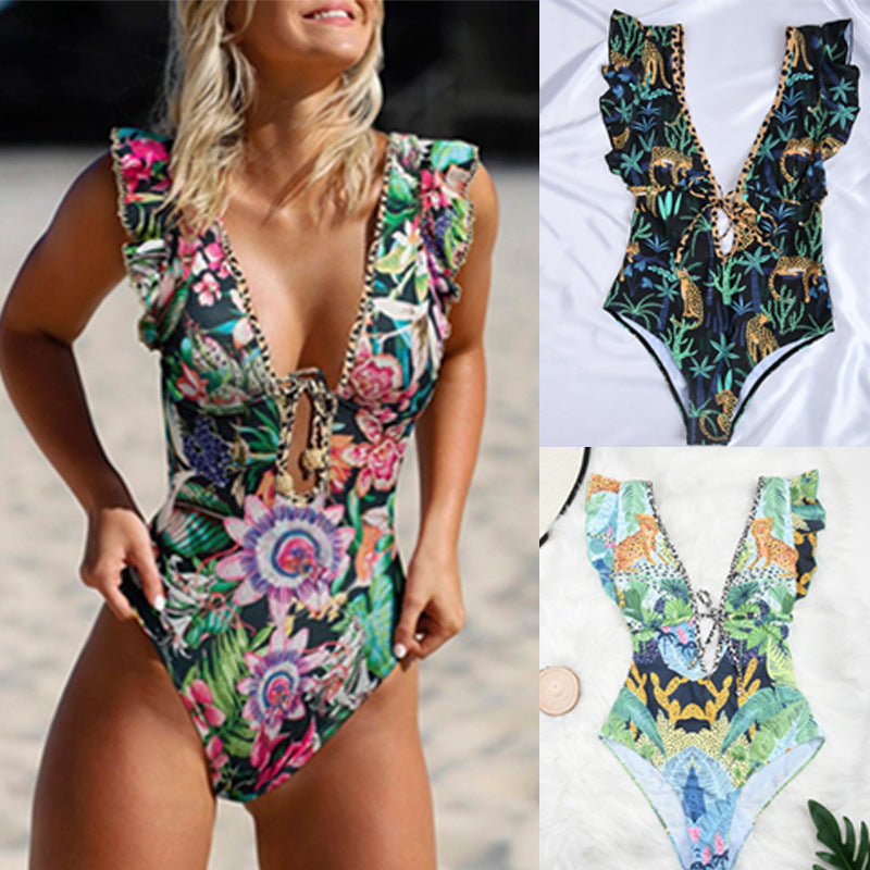 A woman in a Retro Floral Designed One Piece Beach Swimsuit by Beachy Cover Ups.