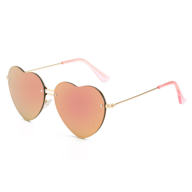 A fashionable pair of Beachy Cover Ups Heart Shaped Rimless Sunglasses perfect for festive occasions.