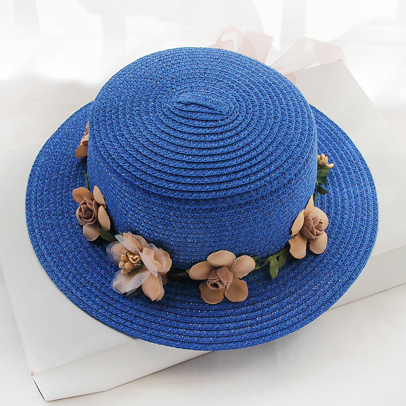 A Flower Designed Beach Hat with flowers on it from Beachy Cover Ups.