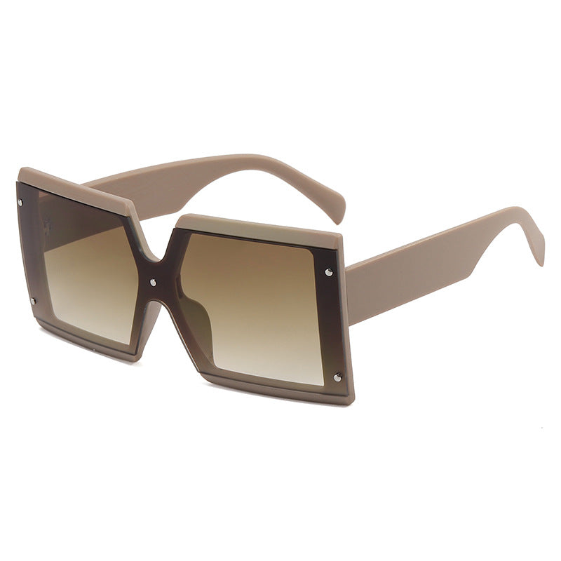 A Beachy Cover Ups Retro Square Sunglasses with a square frame that adds vintage charm.