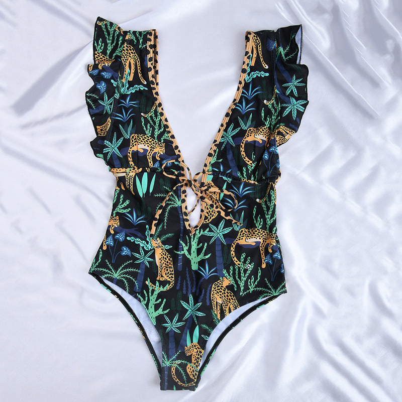 A Beachy Cover Ups Retro Floral Designed One Piece Beach Swimsuit with an animal print.