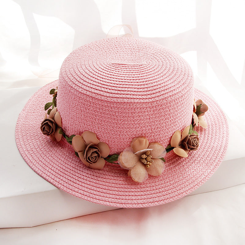 A wide-brimmed Flower Designed Beach Hat with flowers on it from Beachy Cover Ups.