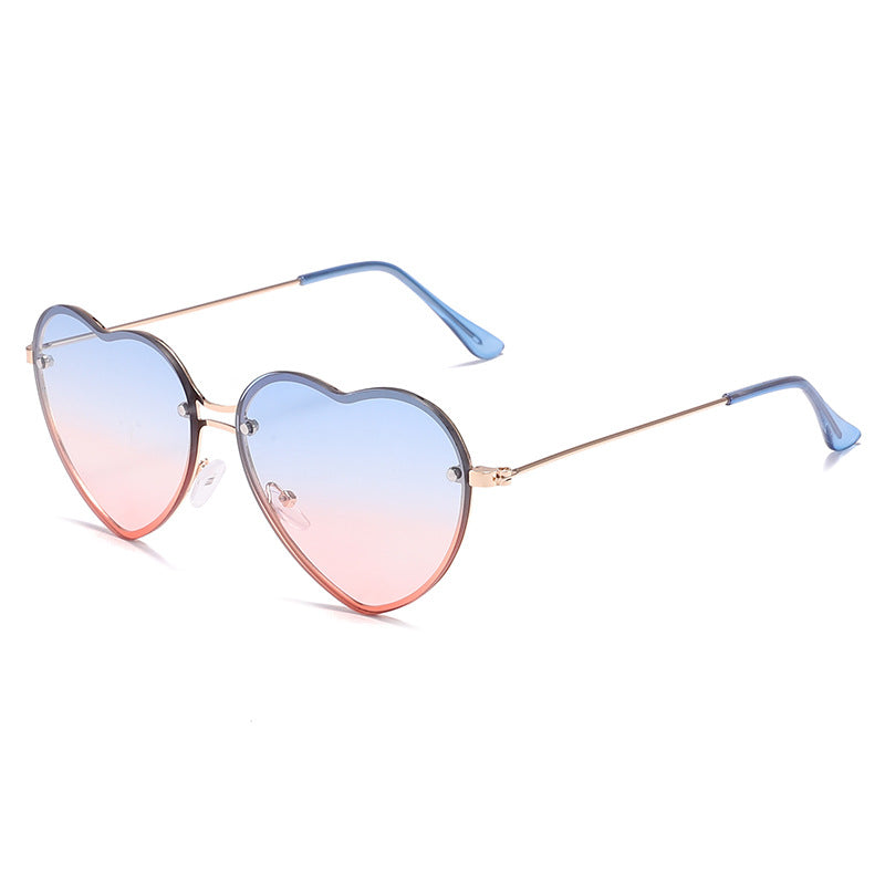 A pair of Beachy Cover Ups heart-shaped rimless sunglasses, a fashion accessory perfect for festive occasions.