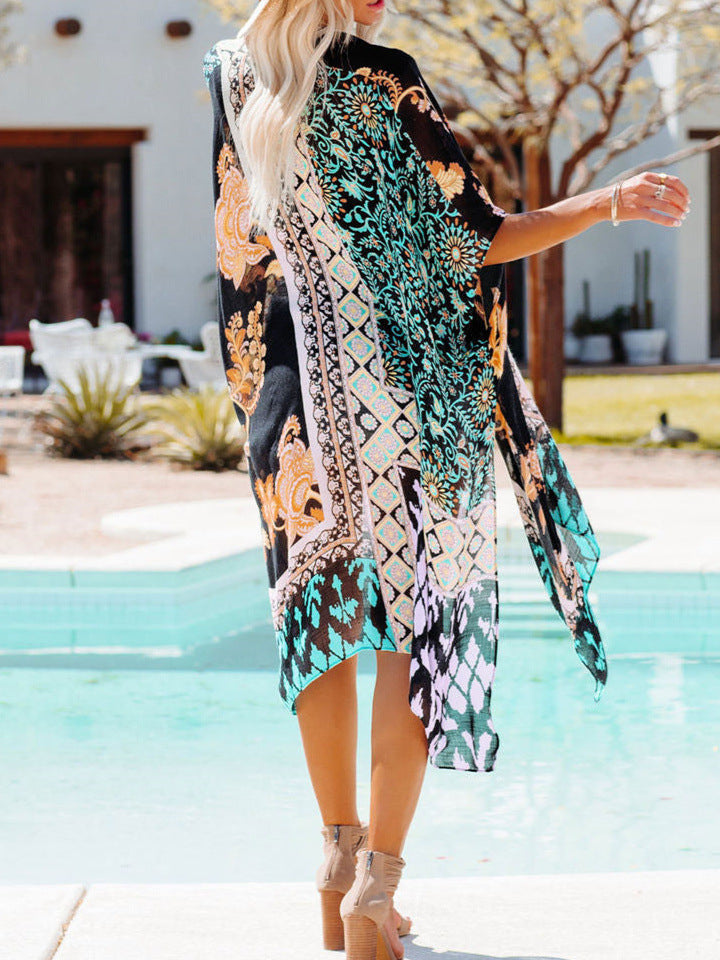 A woman wearing a Beachy Cover Ups Tropical Beach Cardigan Cover Up, vibrant and tropical, standing next to a pool.