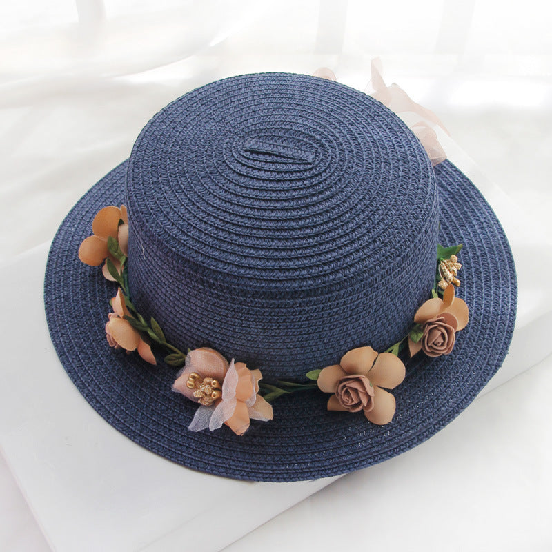 A Flower Designed Beach Hat with flowers on it from Beachy Cover Ups.